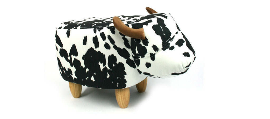 Puff banqueta para apoyar los pies con forma de vaca