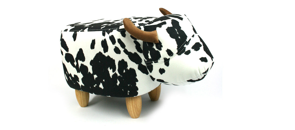 Puff banqueta para apoyar los pies con forma de vaca