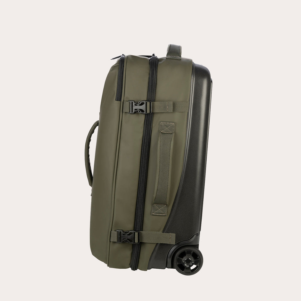 Trolley de viaje Tucano Gommo de 42 litros en verde militar, vista lateral con correas de compresión, cremallera central y rueda negra.